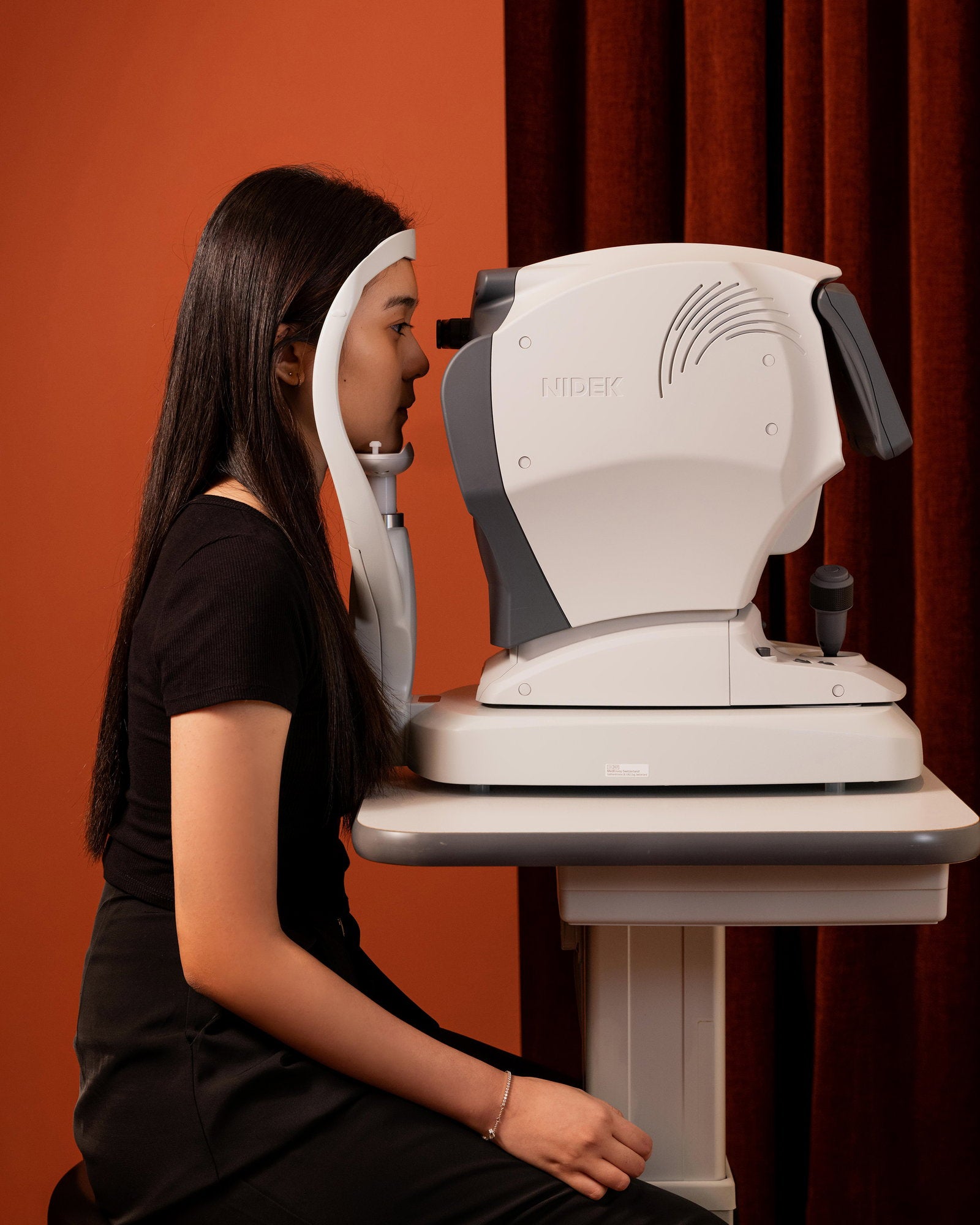Auto refractor measuring a customer’s eyes